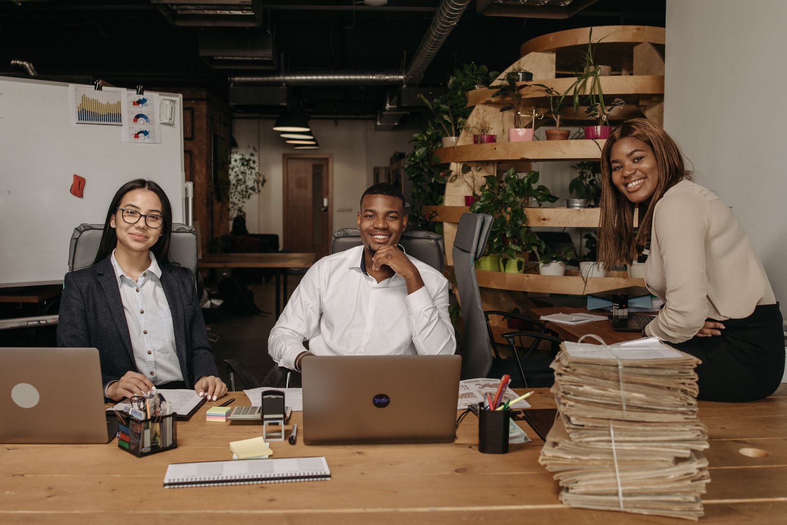 Professional digital team collaborating in a modern workspace
